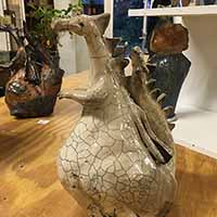 white clay dragon sculpture